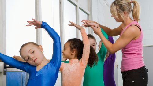 Children being taught ballet