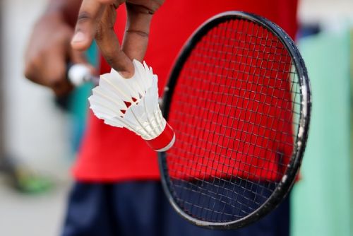 A badminton player ready to seve